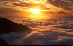 Sunset above clouds